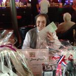 Sr Joan Marie selling raffle tickets at Bowling Alley fundraiser