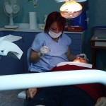 Female Dentist working on a patient