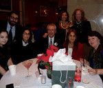 Spirit of Christmas at Rockefeller Plaza attendees pose at table