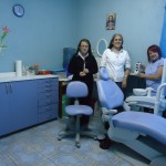 three ladies pose next to New Dental Chair in Barcenas, Guatemala