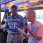 Two people making announcements on Yacht Cruise
