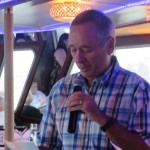 Man holding microphone at Yacht Cruise