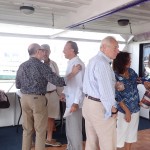 Attendees on the deck of a yacht at “A Tribute on the Hudson” Luncheon Yacht Cruise