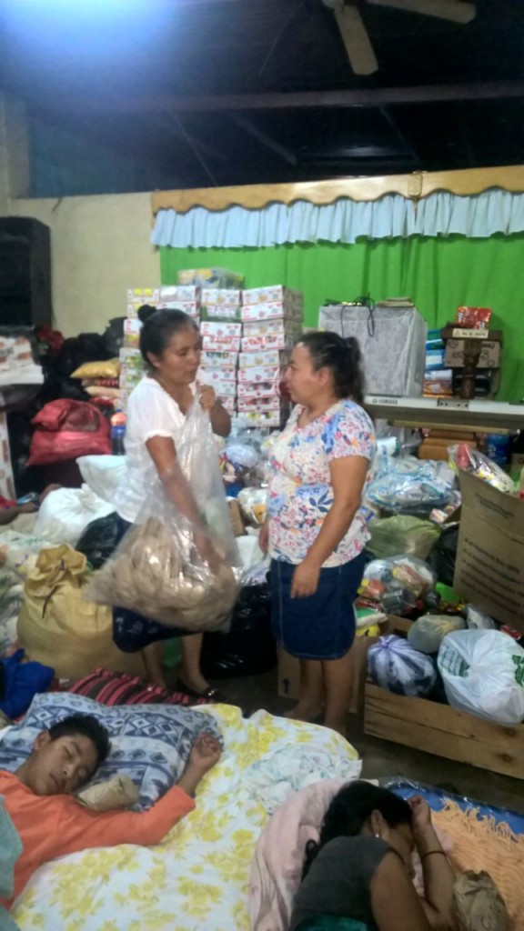 Volunteers with bags of donations at a shelter