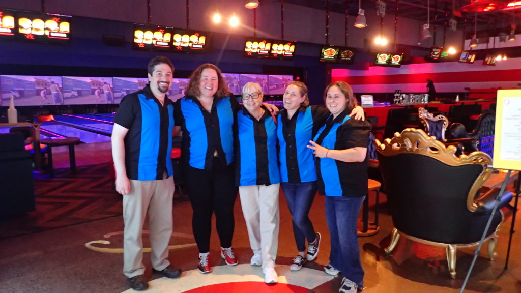 2018 Bowling FUNdraiser at bowling alley 5 bowlers in black and blue matching shirts