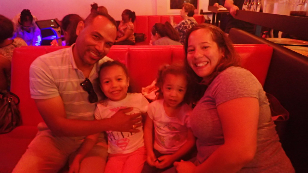 2018 Bowling FUNdraiser group photo at bowling alley with two young girls