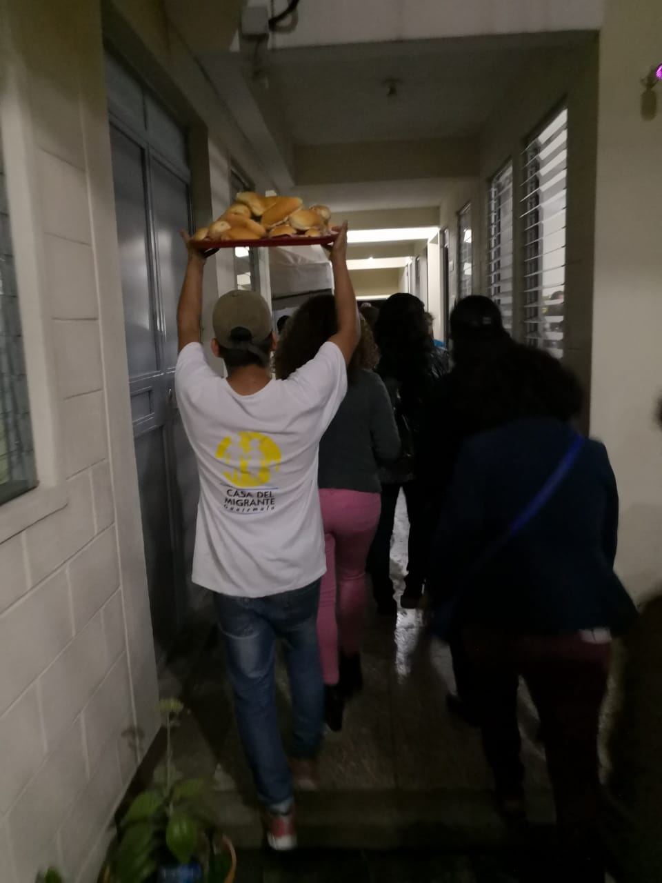 Cabrini Members carrying food to serve Members of the Honduran Migrant Caravan