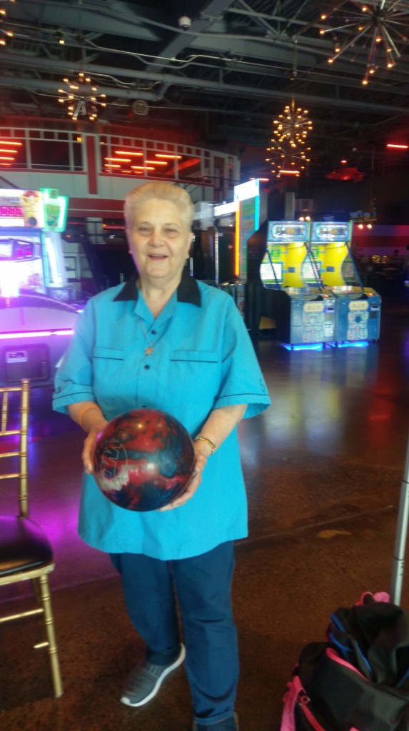 Cabrini Mission 2019 Bowling Event Attendee posing with bowling ball