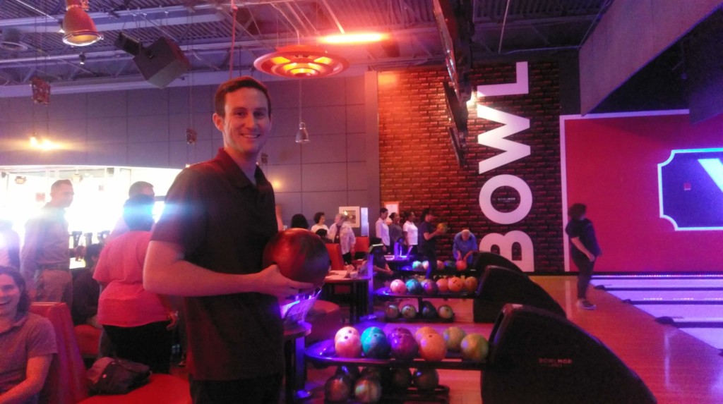 Bowler holding ball at Cabrini Mission 2019 Bowling Event